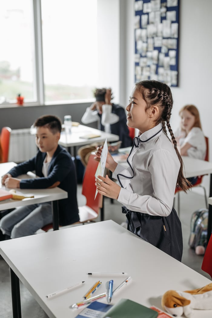 gallery-04 Young students attentively participating in a classroom activity, fostering learning and education.